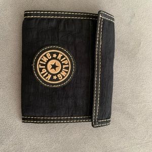 Vintage Kipling Velcro wallet with zipper
compartment
